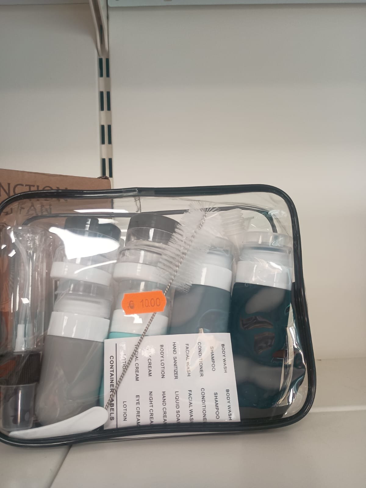 Set flaconi da viaggio con trousse trasparente